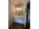 Bathroom vanity with elegant lighting, providing ample space for daily routines at 1273 Jersey Social Circle Rd, Covington, GA 30014