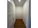 Walk-in closet with hardwood floors, offering ample storage space at 1273 Jersey Social Circle Rd, Covington, GA 30014