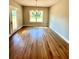 Spacious dining room featuring hardwood floors and a decorative chandelier at 1273 Jersey Social Circle Rd, Covington, GA 30014