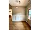 Foyer featuring hardwood floors, wainscoting, natural light and open floor plan at 1273 Jersey Social Circle Rd, Covington, GA 30014