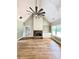 Bright living room features a stone fireplace, hardwood floors and vaulted ceiling at 1273 Jersey Social Circle Rd, Covington, GA 30014