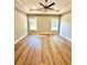 Spacious main bedroom with tray ceiling, ceiling fan, hardwood floors and natural light at 1273 Jersey Social Circle Rd, Covington, GA 30014