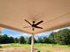 Covered patio with ceiling fan, perfect for outdoor enjoyment and relaxation at 1273 Jersey Social Circle Rd, Covington, GA 30014