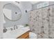 Beautiful bathroom with a vanity, a framed round mirror, and a shower with a 'Paris' themed curtain at 3012 Keeneland Blvd, Mcdonough, GA 30252