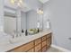 Bathroom featuring double sinks, a large mirror, and ample lighting, providing a luxurious feel at 3012 Keeneland Blvd, Mcdonough, GA 30252