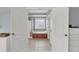 Beautiful bathroom with double sinks, glass block window, and jacuzzi tub through the doorway at 3012 Keeneland Blvd, Mcdonough, GA 30252