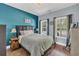 Charming bedroom with hardwood floors, a comfortable bed, and two windows providing ample natural light at 3012 Keeneland Blvd, Mcdonough, GA 30252