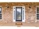 Inviting front entrance with a decorative glass door framed by sidelights and a beautiful stone facade at 3012 Keeneland Blvd, Mcdonough, GA 30252