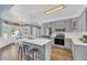 Charming kitchen offers stainless appliances, center island and a view of the dining area at 3012 Keeneland Blvd, Mcdonough, GA 30252