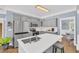 Light-filled kitchen with stainless appliances, a central island and seamless access to dining at 3012 Keeneland Blvd, Mcdonough, GA 30252
