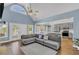 Bright living room features vaulted ceiling, French doors, and adjoins an open kitchen at 3012 Keeneland Blvd, Mcdonough, GA 30252