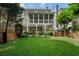 Lush backyard featuring a spacious lawn, landscaping, and a screened porch for outdoor enjoyment at 785 Wilson Nw Rd, Atlanta, GA 30318