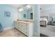 Bright bathroom with double sinks and marble countertops next to bedroom at 785 Wilson Nw Rd, Atlanta, GA 30318