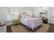 Cozy bedroom features a stylish bed, desk area, and ample natural light from shuttered windows at 785 Wilson Nw Rd, Atlanta, GA 30318