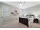 Cozy bedroom with neutral walls, carpet, ceiling fan, and framed pictures for a comfortable and relaxing space at 785 Wilson Nw Rd, Atlanta, GA 30318