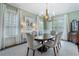 Elegant dining room featuring hardwood floors, stylish lighting, and neutral decor at 785 Wilson Nw Rd, Atlanta, GA 30318