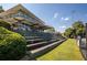 Modern building overlooking tiered seating and a tennis court, all set in a beautifully landscaped area at 785 Wilson Nw Rd, Atlanta, GA 30318