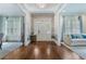 Elegant foyer with hardwood floors, stylish wallpaper, and views into adjoining living spaces at 785 Wilson Nw Rd, Atlanta, GA 30318