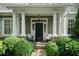 Inviting front porch with elegant columns, stone accents, and comfortable seating at 785 Wilson Nw Rd, Atlanta, GA 30318