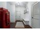 Welcoming hallway with unique vintage Coca-Cola refrigerator, mud bench with storage, and bike rack at 785 Wilson Nw Rd, Atlanta, GA 30318