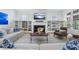 Comfortable living room features built-in bookshelves, a fireplace, and large windows at 785 Wilson Nw Rd, Atlanta, GA 30318