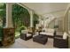Inviting outdoor patio with stone pillars and comfortable wicker furniture, ideal for relaxation at 785 Wilson Nw Rd, Atlanta, GA 30318