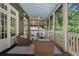 Inviting screened-in porch with comfortable seating and serene outdoor views at 785 Wilson Nw Rd, Atlanta, GA 30318