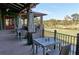 Outdoor dining area with tables and chairs overlooking a lush golf course at 785 Wilson Nw Rd, Atlanta, GA 30318