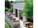 Outdoor dining at Howell's, featuring shaded tables and stylish decor in a vibrant community setting at 785 Wilson Nw Rd, Atlanta, GA 30318