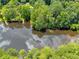 Aerial view of property with lake access surrounded by mature trees at 2736 Whisper Trl, Douglasville, GA 30135