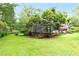 Spacious backyard featuring a lush green lawn, mature trees and landscaping at 2736 Whisper Trl, Douglasville, GA 30135
