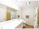 Bathroom featuring a large mirror, vanity, and shower-tub combination at 2736 Whisper Trl, Douglasville, GA 30135