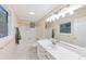 Bright bathroom with a large mirror, vanity, and shower-tub combination at 2736 Whisper Trl, Douglasville, GA 30135