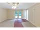 Bedroom with ceiling fan and doors leading to outdoor balcony at 2736 Whisper Trl, Douglasville, GA 30135
