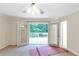 Bedroom with ceiling fan and doors leading to outdoor balcony at 2736 Whisper Trl, Douglasville, GA 30135