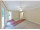 Bedroom with ceiling fan and doors leading to outdoor balcony at 2736 Whisper Trl, Douglasville, GA 30135