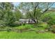 Quaint single-story home with well-kept lawn and landscaping creates a serene and inviting outdoor space at 2736 Whisper Trl, Douglasville, GA 30135