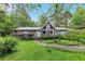 Charming single-story home with a well-manicured lawn, lush landscaping, and inviting curb appeal at 2736 Whisper Trl, Douglasville, GA 30135