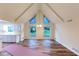 Bright, open-concept living space with vaulted ceilings, hardwood floors, and large windows at 2736 Whisper Trl, Douglasville, GA 30135