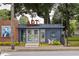 Charming art space with unique design elements, surrounded by colorful flowers and greenery at 3484 Orchard St, Atlanta, GA 30354