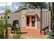 Exterior view of a charming artspace building, featuring a brick walkway and inviting benches at 3484 Orchard St, Atlanta, GA 30354
