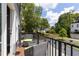 Relaxing back porch with outdoor seating, wooden deck, with views of landscaped backyard and sky at 3484 Orchard St, Atlanta, GA 30354