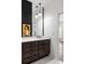 This spacious bathroom features granite countertop, wood cabinet and marble tiled floors at 3484 Orchard St, Atlanta, GA 30354