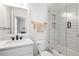 This bathroom features modern fixtures, and a white-tiled tub/shower combo at 3484 Orchard St, Atlanta, GA 30354