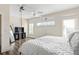 Bright bedroom includes a ceiling fan, wood floors, TV and plenty of natural light at 3484 Orchard St, Atlanta, GA 30354