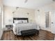 This bedroom offers stylish furnishings, wood floors and an ensuite bathroom at 3484 Orchard St, Atlanta, GA 30354