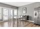 Bright dining room featuring wood floors, stainless steel appliances, and large windows at 3484 Orchard St, Atlanta, GA 30354