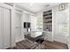 Well-lit dressing room with custom shelves, mirrored desk, and hardwood floors at 3484 Orchard St, Atlanta, GA 30354