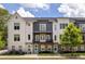 Attractive three-story townhome with Hardie Board siding, brick accents, and a charming second-story balcony at 3484 Orchard St, Atlanta, GA 30354