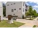 The Landing at Virginia Park community sign in front of modern townhomes with lush greenery and sidewalks at 3484 Orchard St, Atlanta, GA 30354